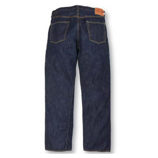 Back view of a pair of dark blue jeans on a white background