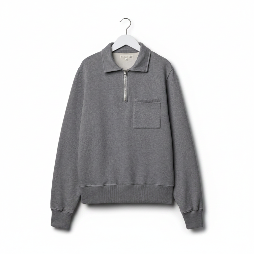 Gray sweatshirt with a zipper on a beige background