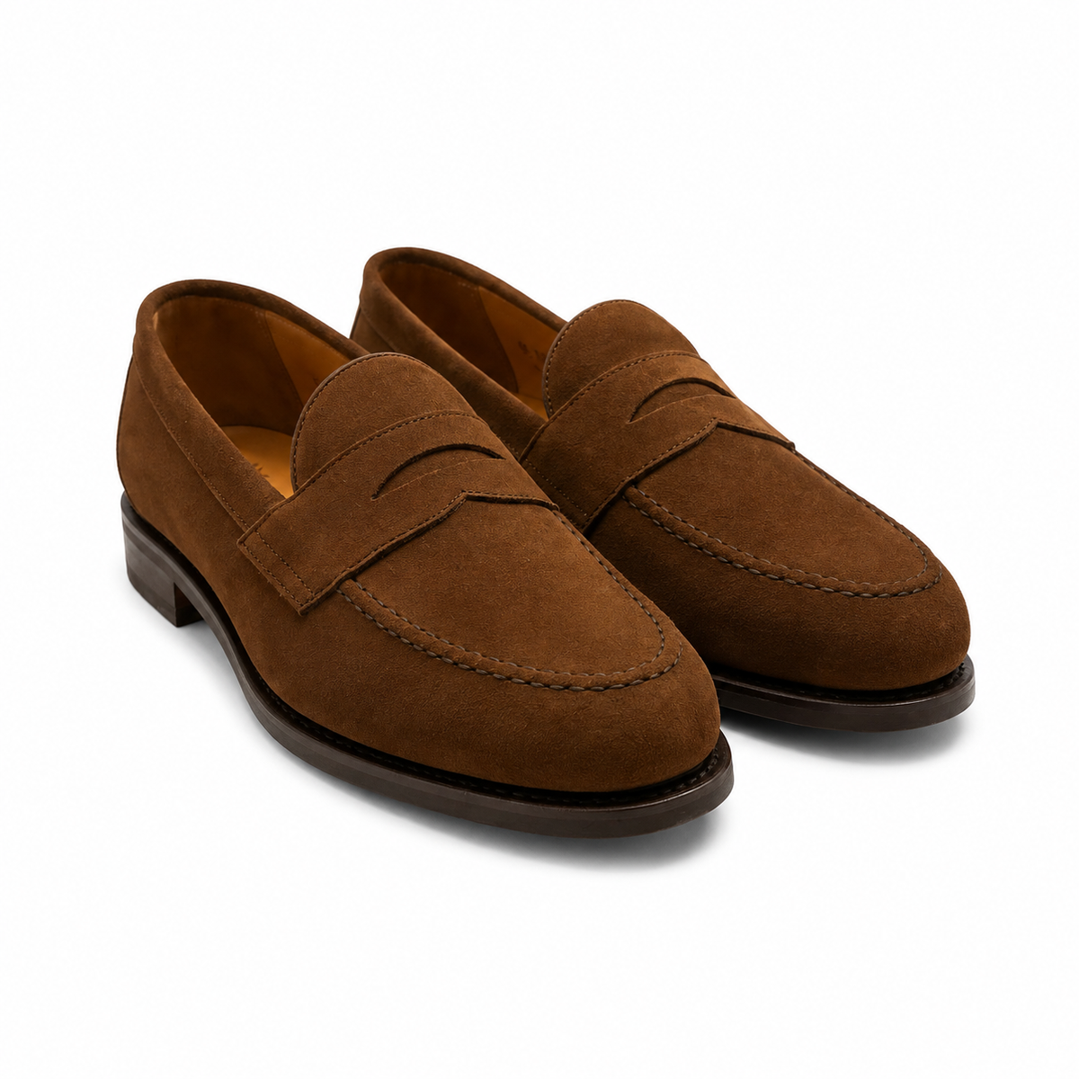A pair of men's brown suede penny loafers with classic contrast stitching, displayed on a clean white background.