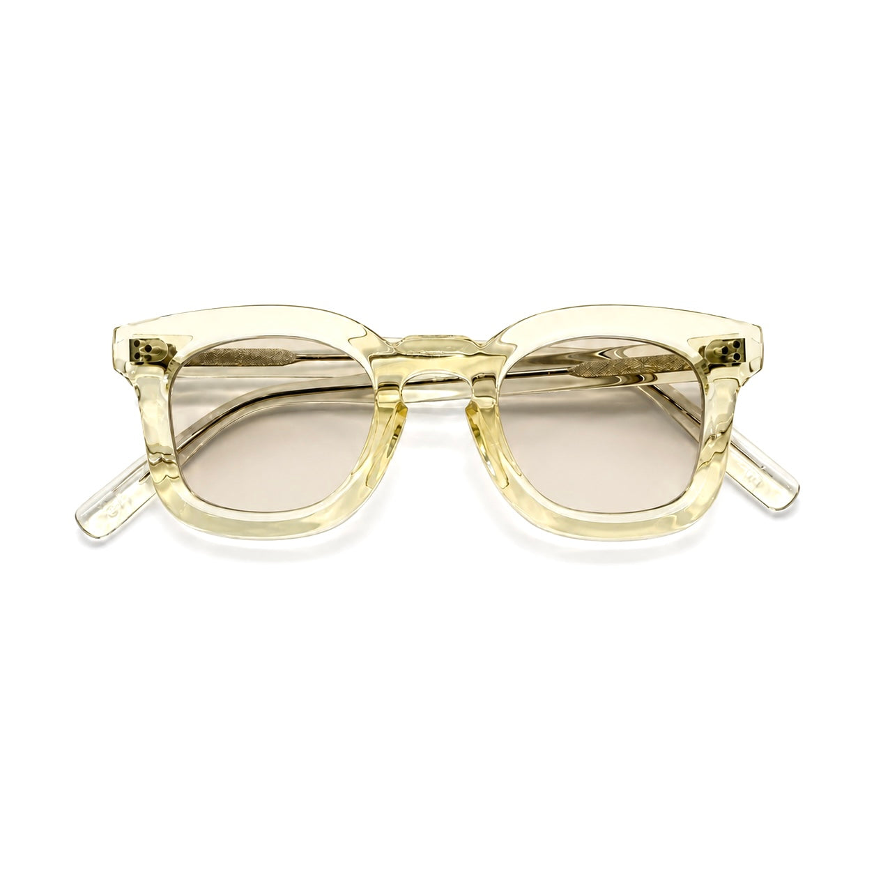 A pair of oversized square sunglasses with a translucent pale yellow acetate frame and light brown tinted lenses, shown against a plain white background.