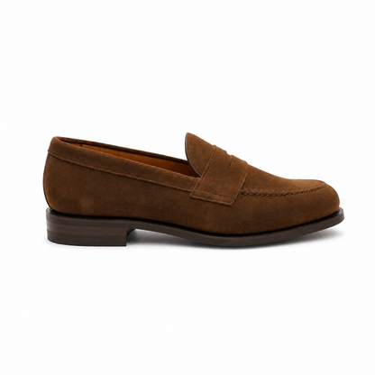 A single brown suede penny loafer shown in profile against a plain white background.