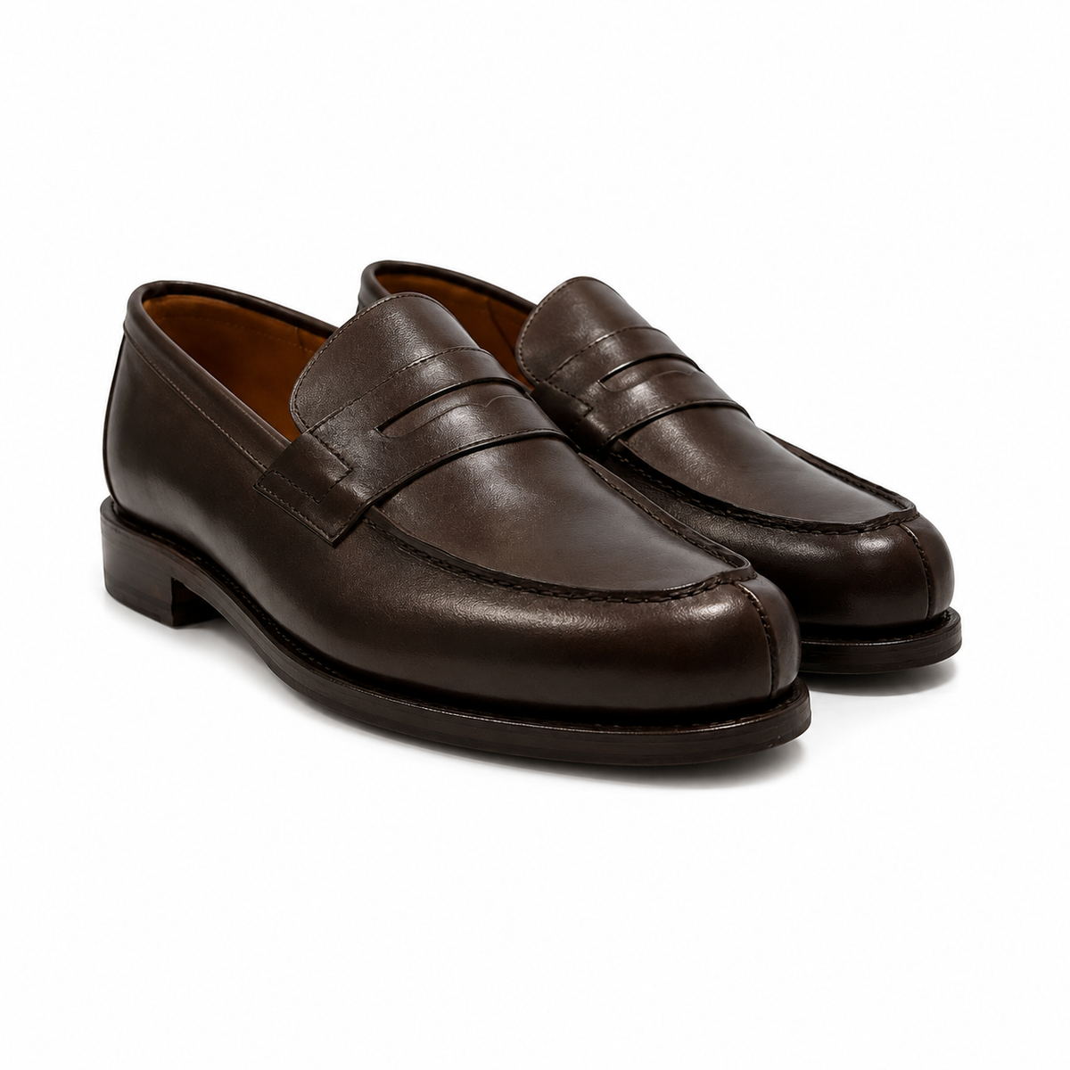 A pair of dark brown leather penny loafers with a classic cap-toe design and decorative stitching, displayed on a clean white background.