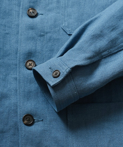 Close-up of a blue shirt with buttons and a collar