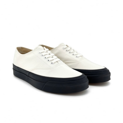Asahi white and black deck shoes, casual footwear with white and black color blocking, displayed on a plain background.