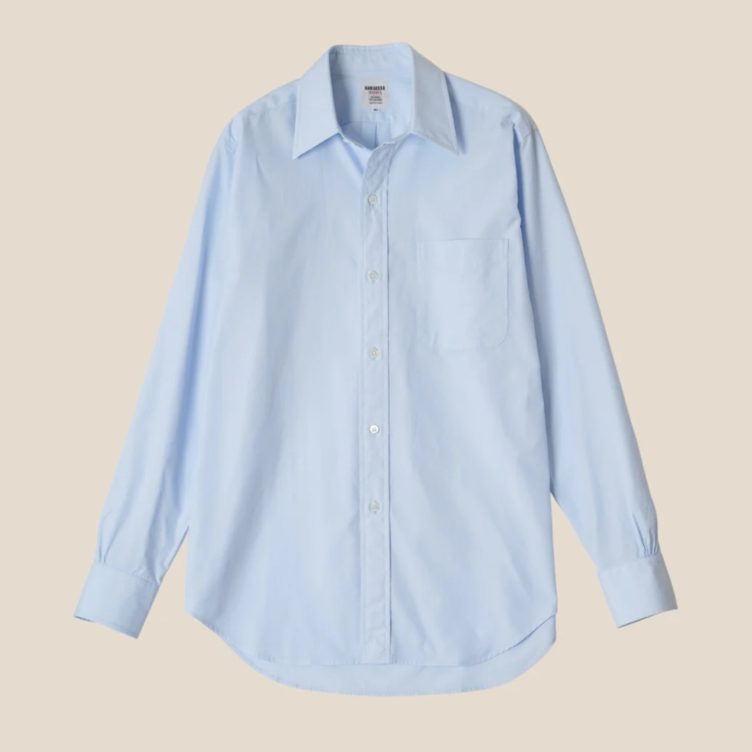 Light blue button-up shirt on a beige background