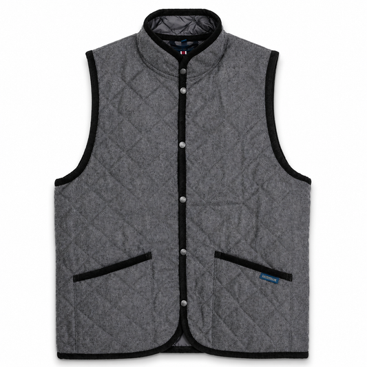 A gray quilted wool vest with black trim, featuring a stand-up collar, snap-button front, and two front patch pockets, shown against a plain white background.