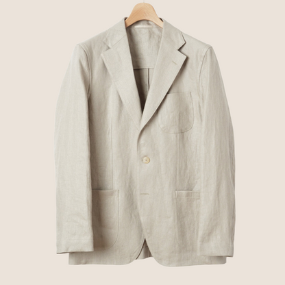 Light gray blazer on a beige background