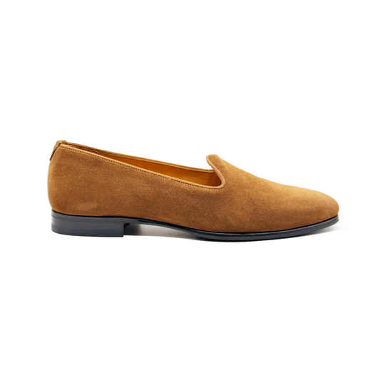 Brown suede loafer shoe on a white background