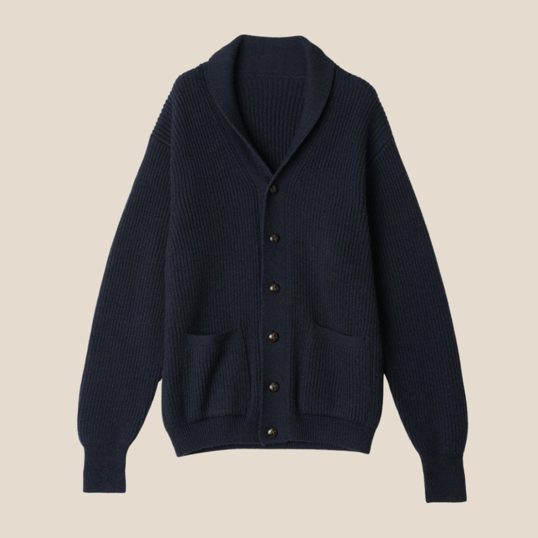 Dark blue cardigan with button details on a beige background