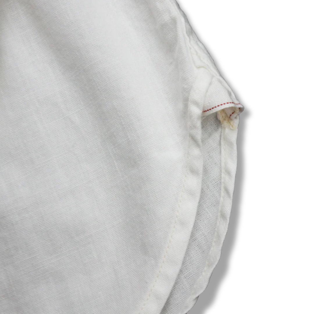 Close-up of a light gray shirt with a collar on a white background