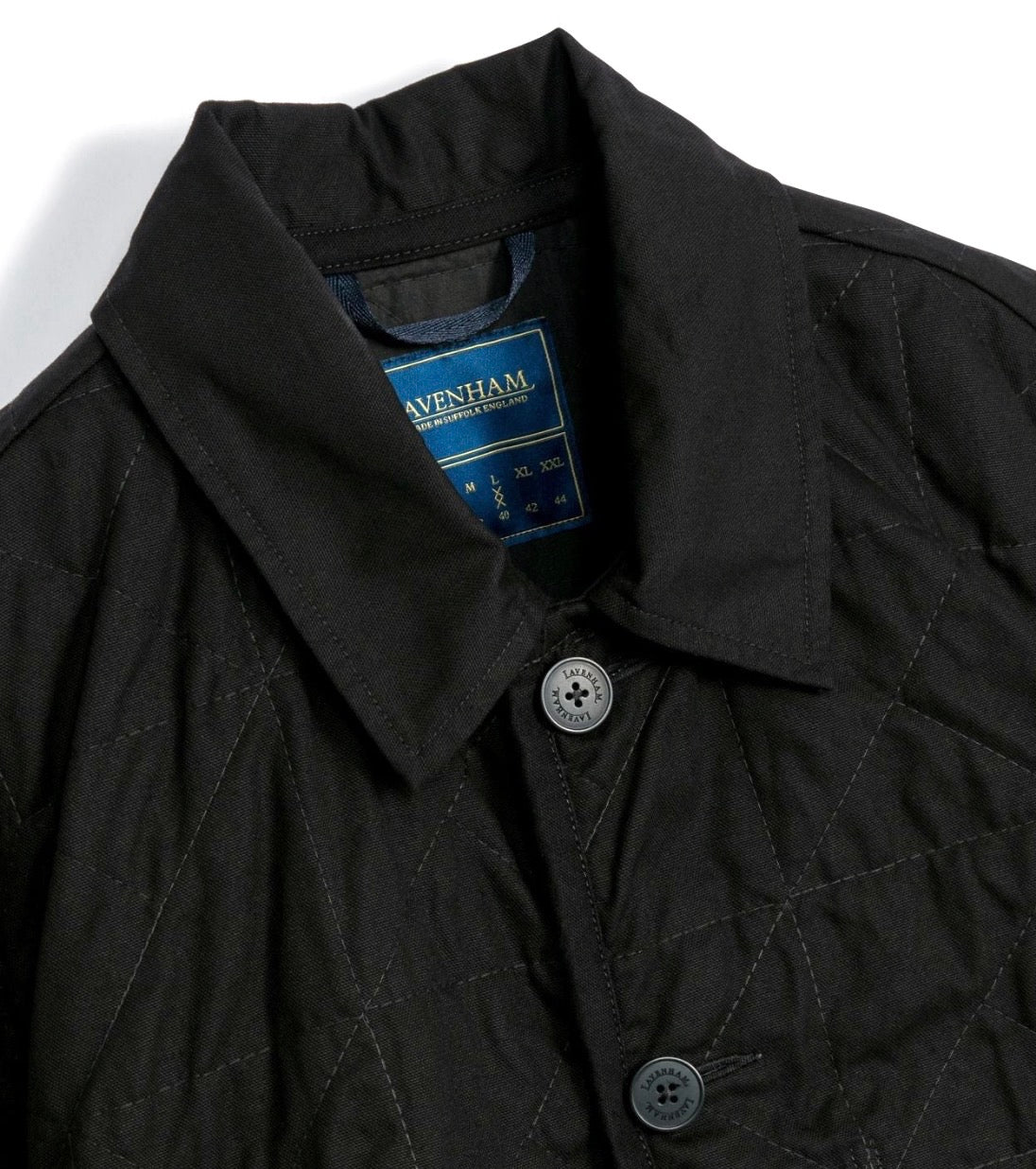 Lavenham unwadded black worker jacket shown on a hanger, featuring durable outerwear design with a classic, rugged style.