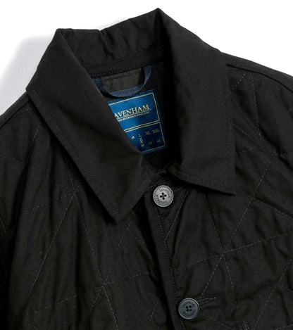 Lavenham unwadded black worker jacket shown on a hanger, featuring durable outerwear design with a classic, rugged style.