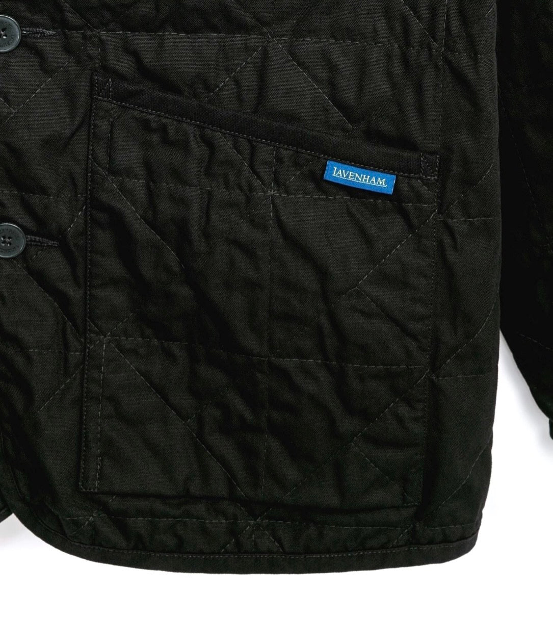 Lavenham unwadded black worker jacket, durable outerwear with a classic design, shown on a hanger.