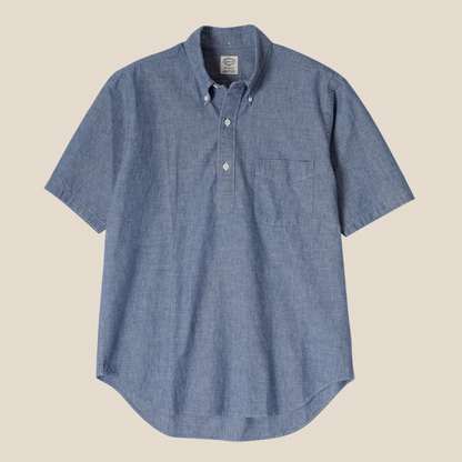 Blue short-sleeve shirt on a beige background