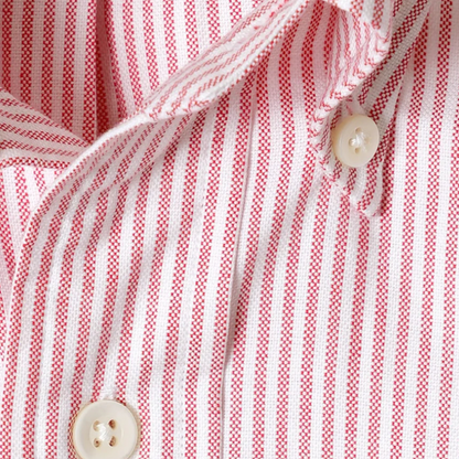 Close-up of a red and white striped fabric with buttons.
