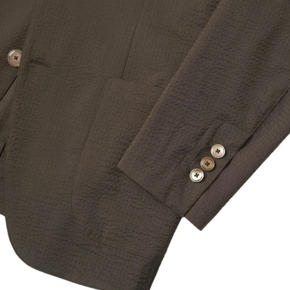 Kamakura brown seersucker jacket with lightweight, textured fabric, front button closure, and classic collar detail.
