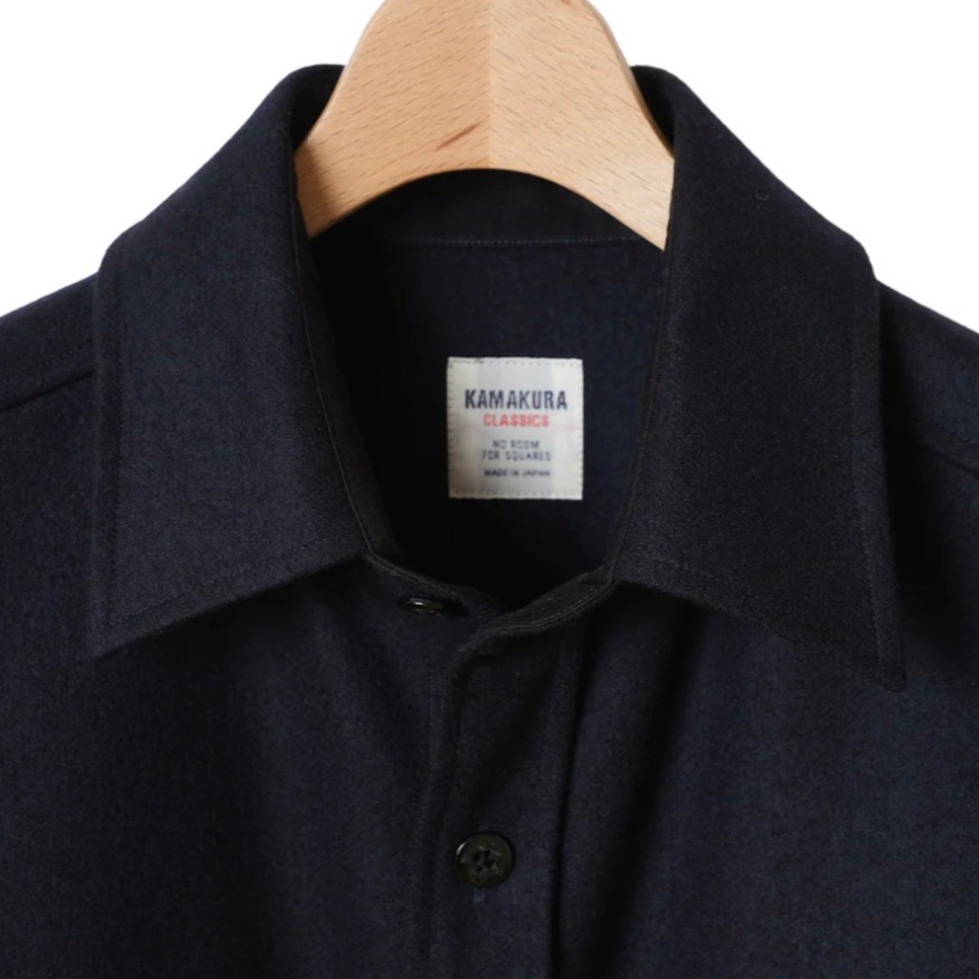 Kamakura navy wool flannel CPO over shirt displayed flat, showing classic collar and button-front design.