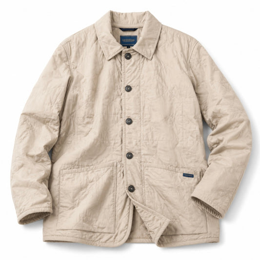 A light beige crinkled cotton utility jacket with a button-up front, collar, and two front patch pockets, laid flat on a white background.