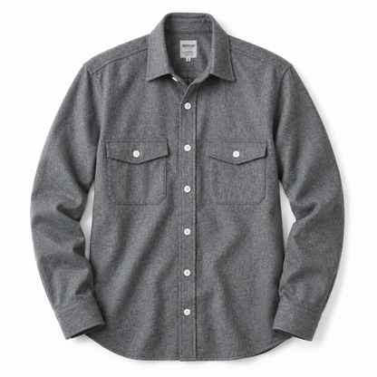 A dark gray heathered long-sleeve button-up shirt with two buttoned chest pockets, displayed flat against a white background.