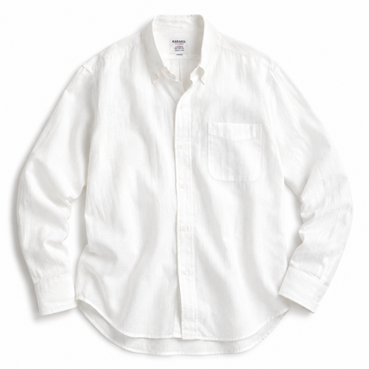 A white long-sleeve button-down shirt with a single chest pocket, laid flat against a white background.
