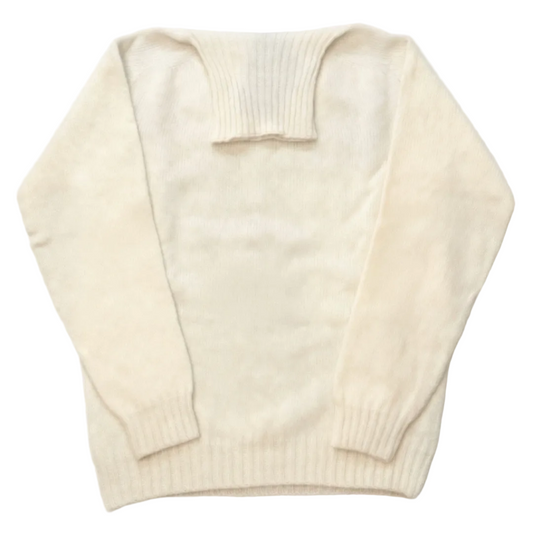 Cream-colored sweater on a white background