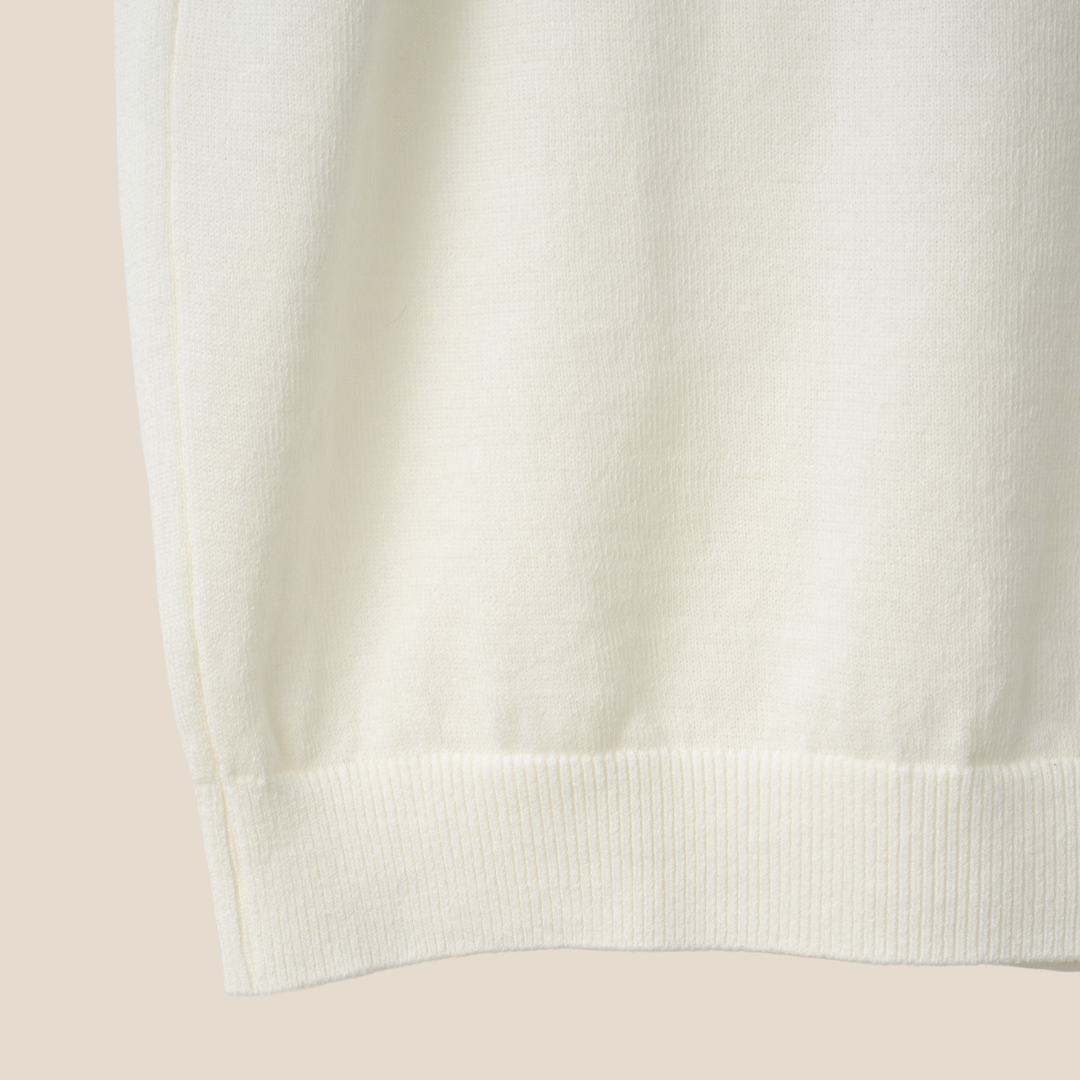 Mooncastle Ice Cotton Polo shirt in off-white with short sleeves, featuring a classic polo collar and subtle branding details.