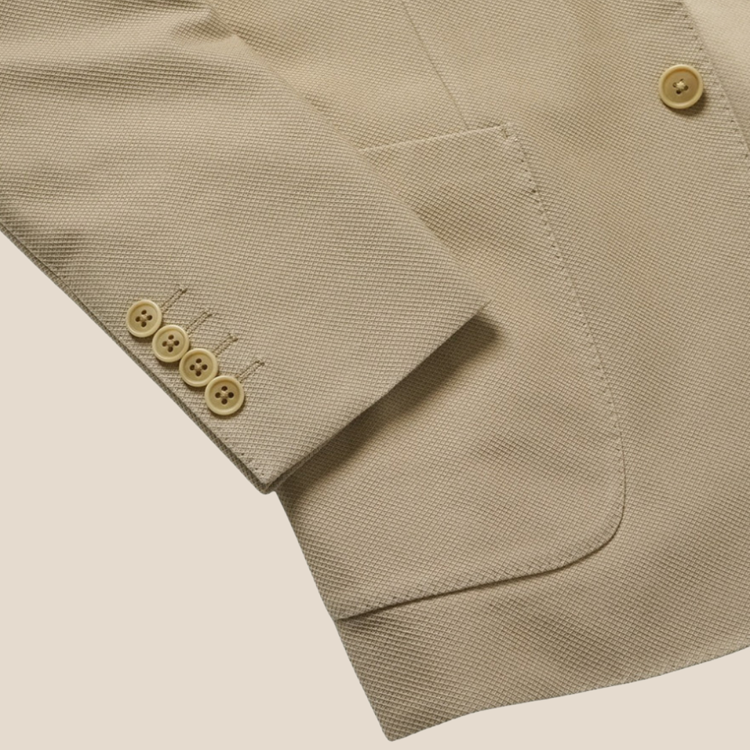 Kamakura beige cotton stretch blazer jacket with tailored fit and classic lapel, shown on a model against a neutral background.