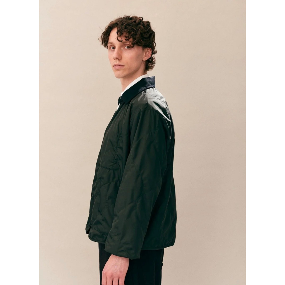 Lavenham olive windbreaker jacket, lightweight outerwear with a smooth fabric finish and a hood, displayed on a plain background.