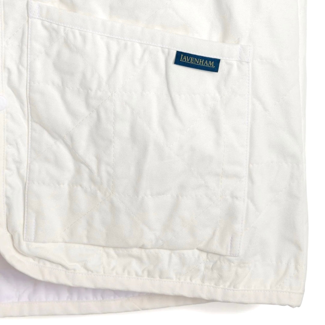 Lavenham Thornham Gilet in white cotton, lightweight outerwear with a quilted design and stand collar.