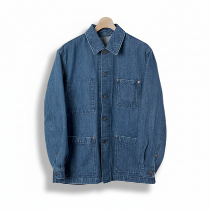 Blue denim jacket on a beige background