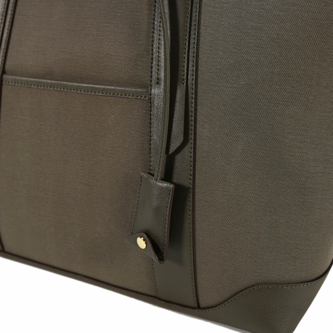 Khaki canvas tote bag from Adam’s Peach with handles, showcasing a casual accessories style.