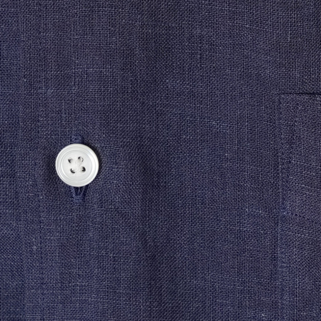 Kamakura Belgian linen short sleeve shirt in navy, featuring a relaxed fit and classic collar, displayed on a hanger.