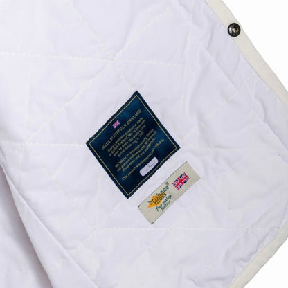 Lavenham Thornham Gilet Cotton in white, showcasing the lightweight outerwear design with a zip front and quilted texture.