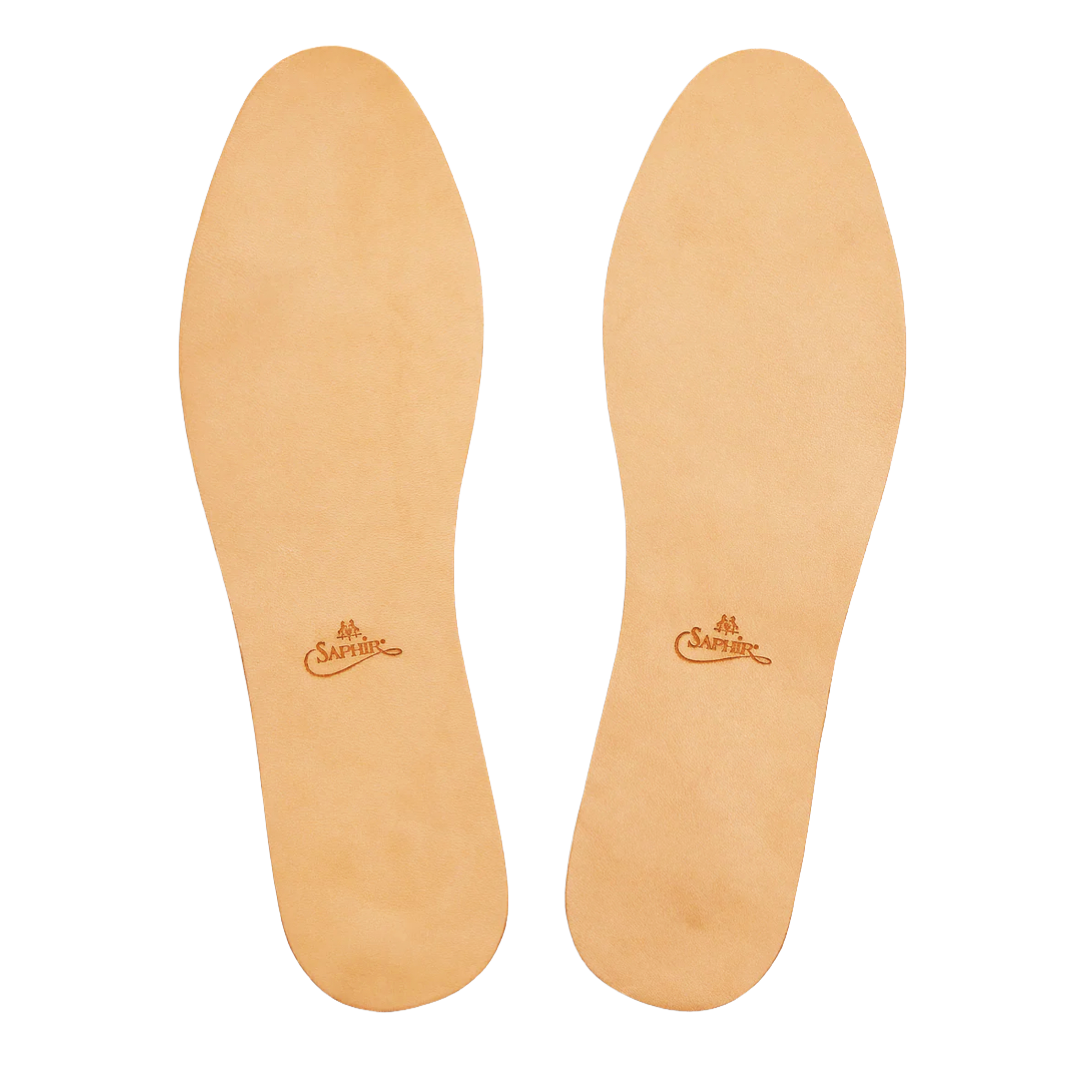 Saphir Vegetable Tanned Insole for shoe care, showing a close-up of the natural leather insole with detailed stitching and branding.
