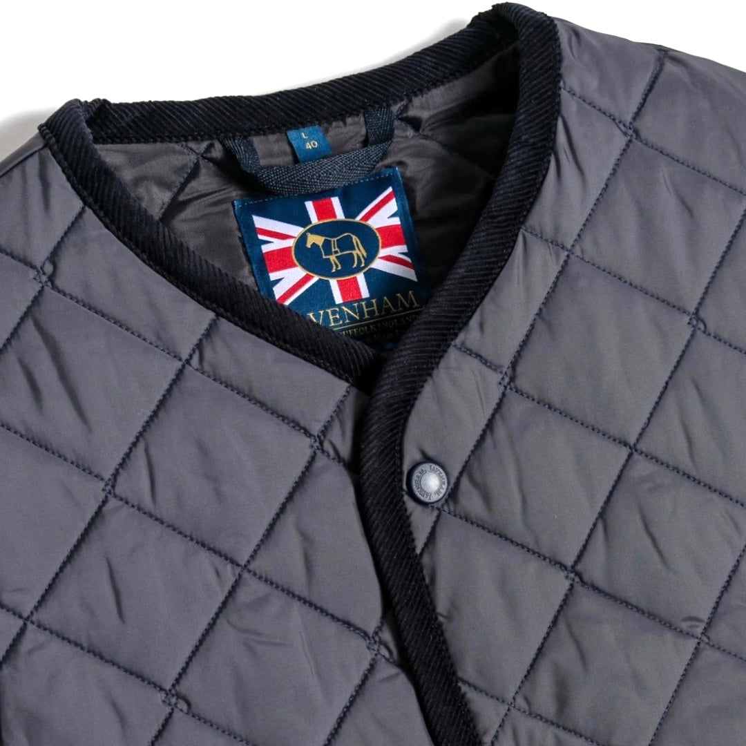 Lavenham Thornham Gilet in navy, a stylish quilted outerwear vest with a high collar and front button closure.