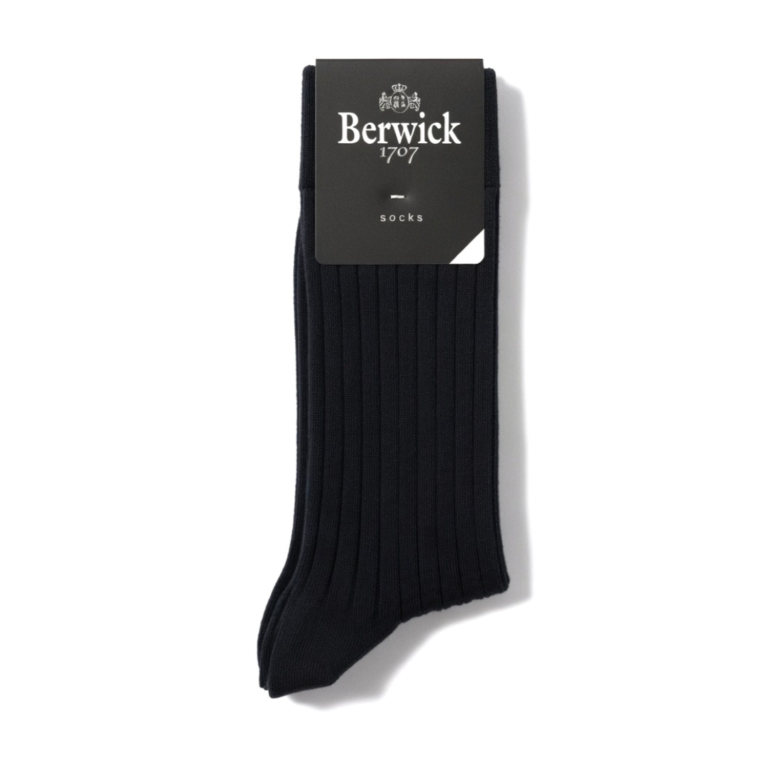 Black Berwick Socks laid flat, highlighting their soft fabric and classic design suitable for casual or formal wear.