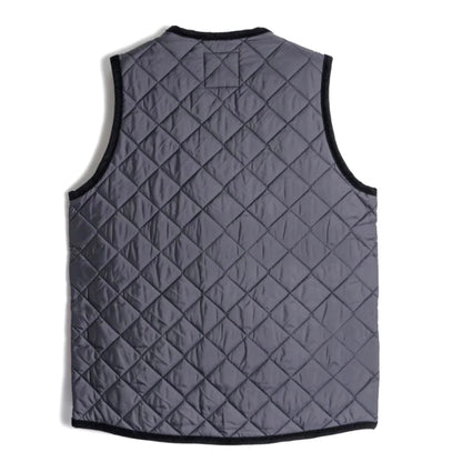 Lavenham Thornham Gilet in navy, a stylish outdoor outerwear piece with a quilted design and front pockets.